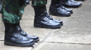 Image of soldier's feet dressed with combat boots