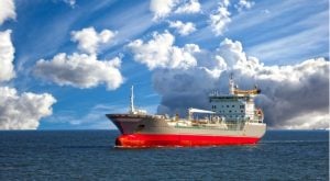 A photo of a red and white tanker ship in the ocean.