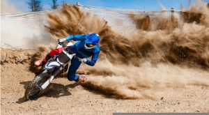 motocross rider on a dirt path representing foxf and fitness stocks to buy