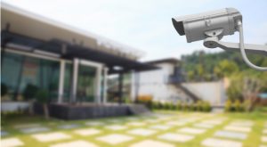 an image of a security camera monitoring a backyard for intruders