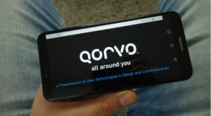 qorvo (QRVO) logo on the screen of a mobile phone