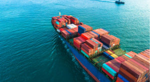 containership on green-blue sea water