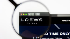 Magnifying glass zooms in on the Loews homepage