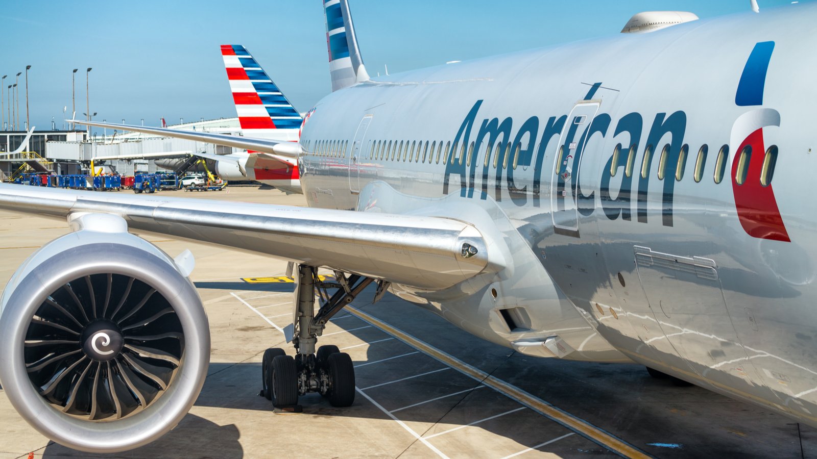 An American Airlines (AAL) airplane waiting on the tarmac. Represents airline stocks.