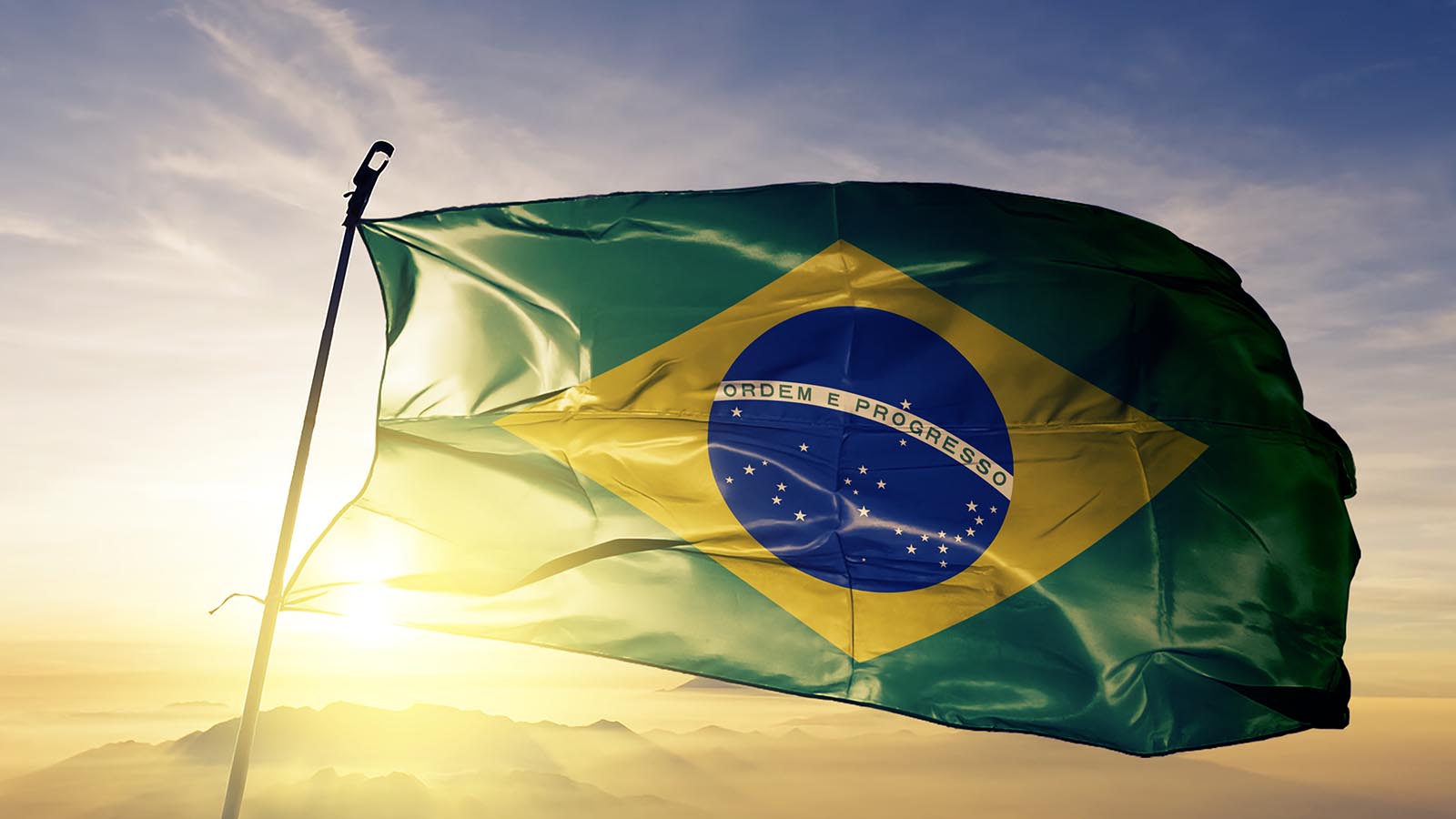 The Brazilian flag with the sun in the background