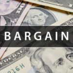 the word bargain over a pile of american money to represent cheap stocks, stocks under $20