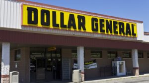 Dollar General (DG) storefront with yellow store sign, noon