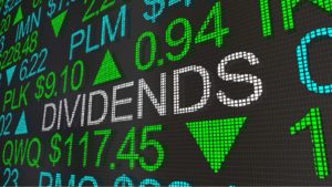 A stock market ticker tape projects the word 