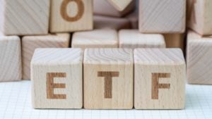 Three wood blocks spelling out "ETF"