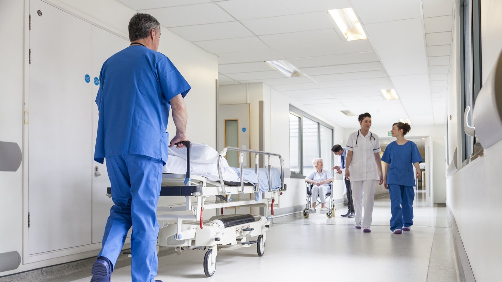 NAOV Stock Image of a hospital with workers walking in the halls 