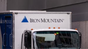 photo of box truck with Iron Mountain (IRM) logo displayed above the truck cab