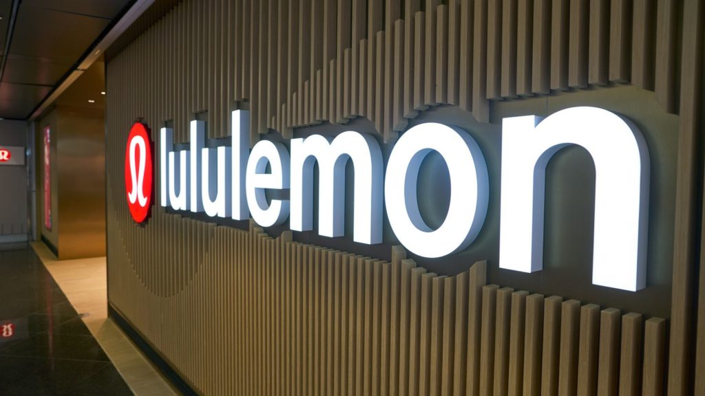 A close-up picture of the Lululemon (LULU) sign in the Hong Kong airport.