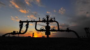 Stocks to buy: a gas pipe with the sun going down in the background