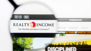 realty income logo highlighted by a magnifying glass on a web browser