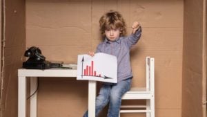 little girl holding a stock chart with athumbs down. tech stocks