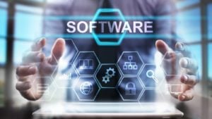 software stocks: Coding software developer work with augmented reality dashboard computer icons of scrum agile development and code fork and versioning with responsive cybersecurity. strong-buy stocks under $10