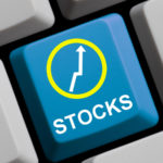 stock button on a computer keyboard (representing best investments to start 2021. stocks to buy