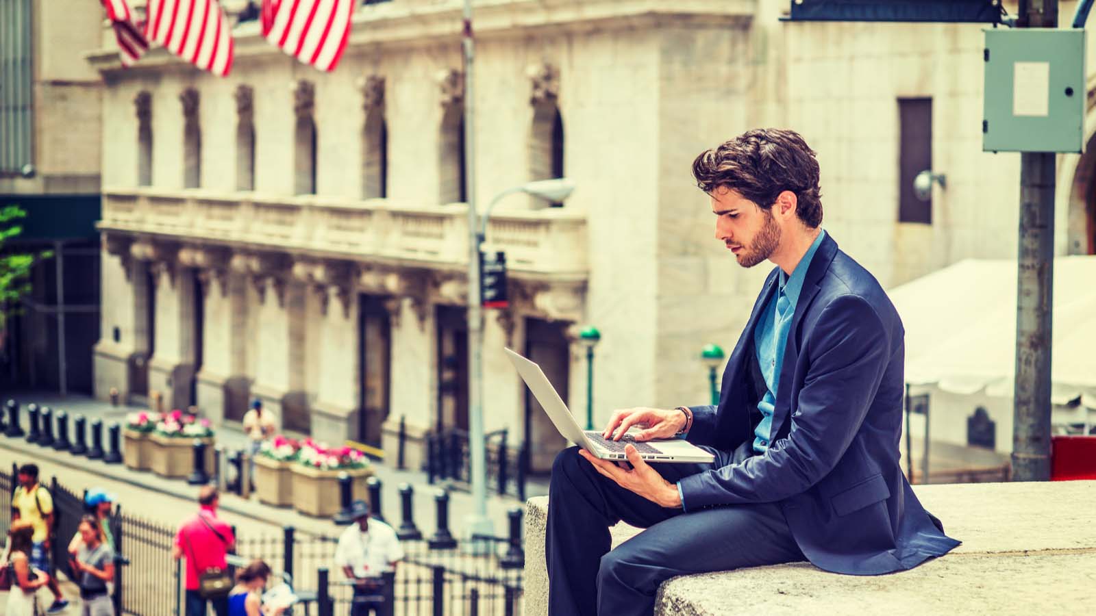 A man on a computer representing BEST stock.