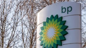 BP (BP) sign with leafless trees in the background, wintertime. Represents BP stock.