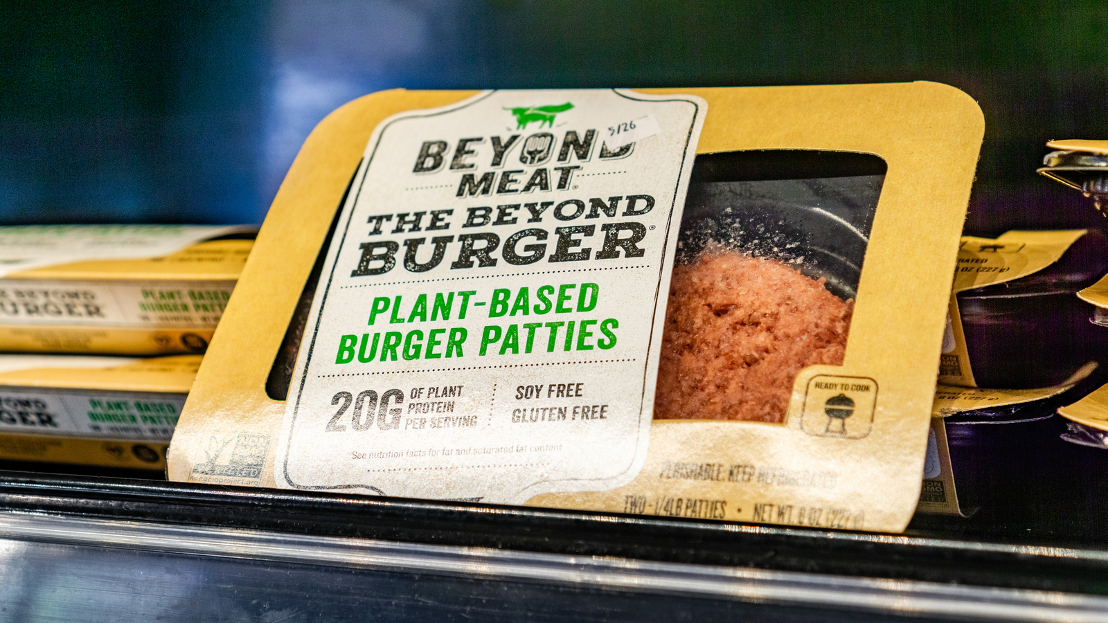 Image of Beyond Meat burger patties on a store shelf representing BYND Stock.