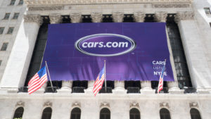 a large banner advertising cars.com, representing cheap stocks