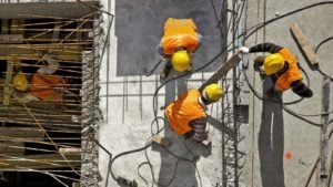 A picture of construction workers on a construction site.