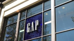 A close-up view of a Gap (GPS) sign in the window of a Los Angeles, California mall. 