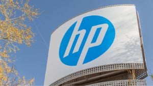 HP (HPQ stock) sign with blue sky and autumn leaves as backdrop