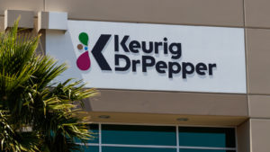 Keurig Dr Pepper (KDP) sign on the front of a building. stocks to buy