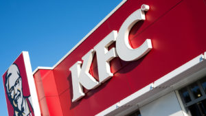 The KFC letters on a store's front sign representing BYND Stock news today.