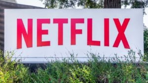 the netflix (NFLX) logo displayed on a sign outside