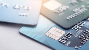 Credit and debit cards scattered on a table