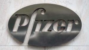 Pfizer logo on metal placard with marble backdrop