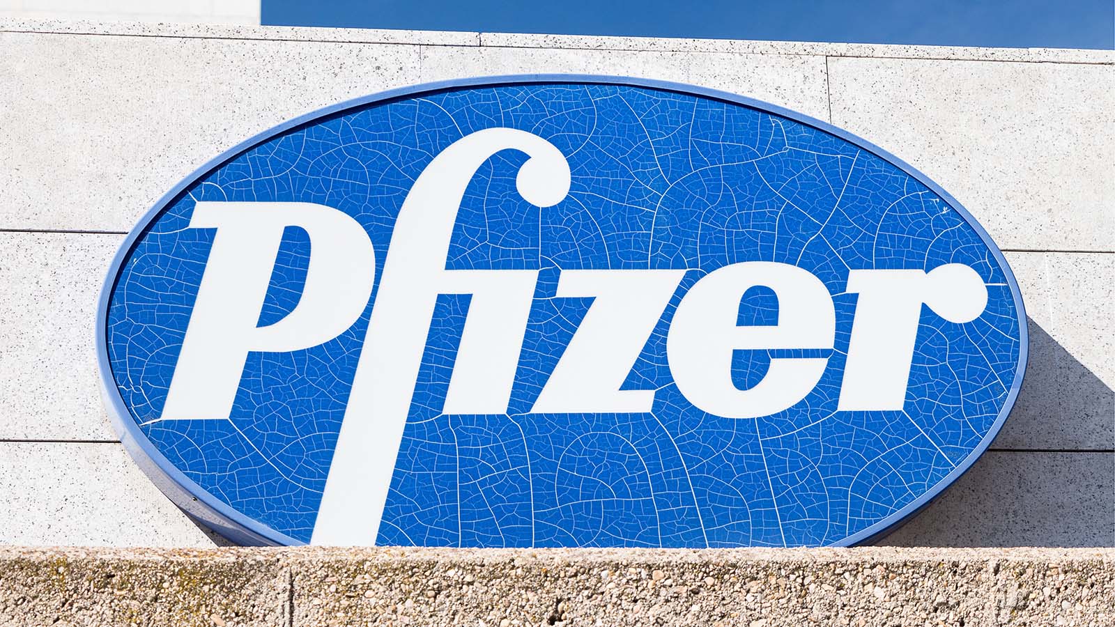PFE Stock. Pfizer logo on Pfizer building. Pfizer is an American pharmaceutical corporation.
