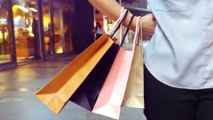 a person carrying several shopping bags