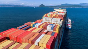 a cargo ship in the middle of the ocean