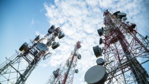 a picture of cell towers during daytime