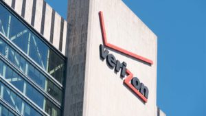 Verizon (VZ) logo on the side of a gray building.