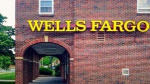 A Wells Fargo (WFC) sign hangs on a brick building in Bloomfield, Connecticut.