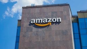 A photo of Amazon's (AMZN) logo on the aide of a building.