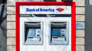 An image of two ATM machines with the Bank of America logo being displayed above them.