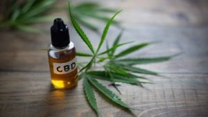 Medicinal cannabis with extract oil in a bottle