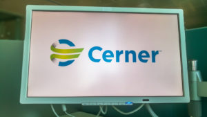 the Cerner (CERN) logo presented on a board