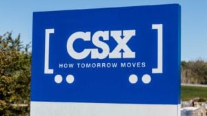 An image of a blue sign displaying the CSX Corp (CSX) logo in white.