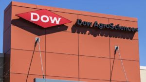 Dow (DOW) logo on a reddish orange building