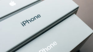Image of Apple's (AAPL) iPhone boxes lined up on table