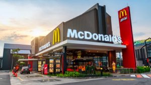 McDonald's (MCD) building with logo at sunset