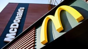 MCD Stock: a McDonald's sign and logo on the side of a building 