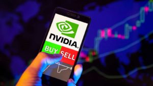 the Nvidia (NVDA) logo on a call phone being held in someone's hand.