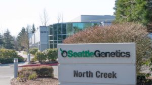 a Seattle Genetics logo (SGNE) on a sign outside of a corporate building